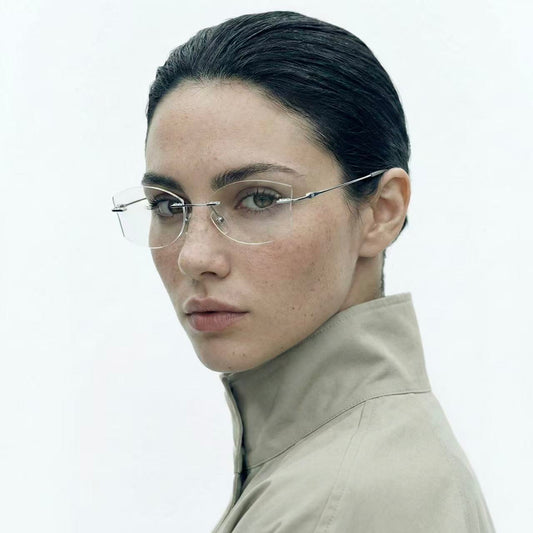 Model wearing Flow titanium geometric rimless glasses in silver