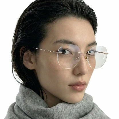 Lume gold titanium geometric rimless glasses worn by model