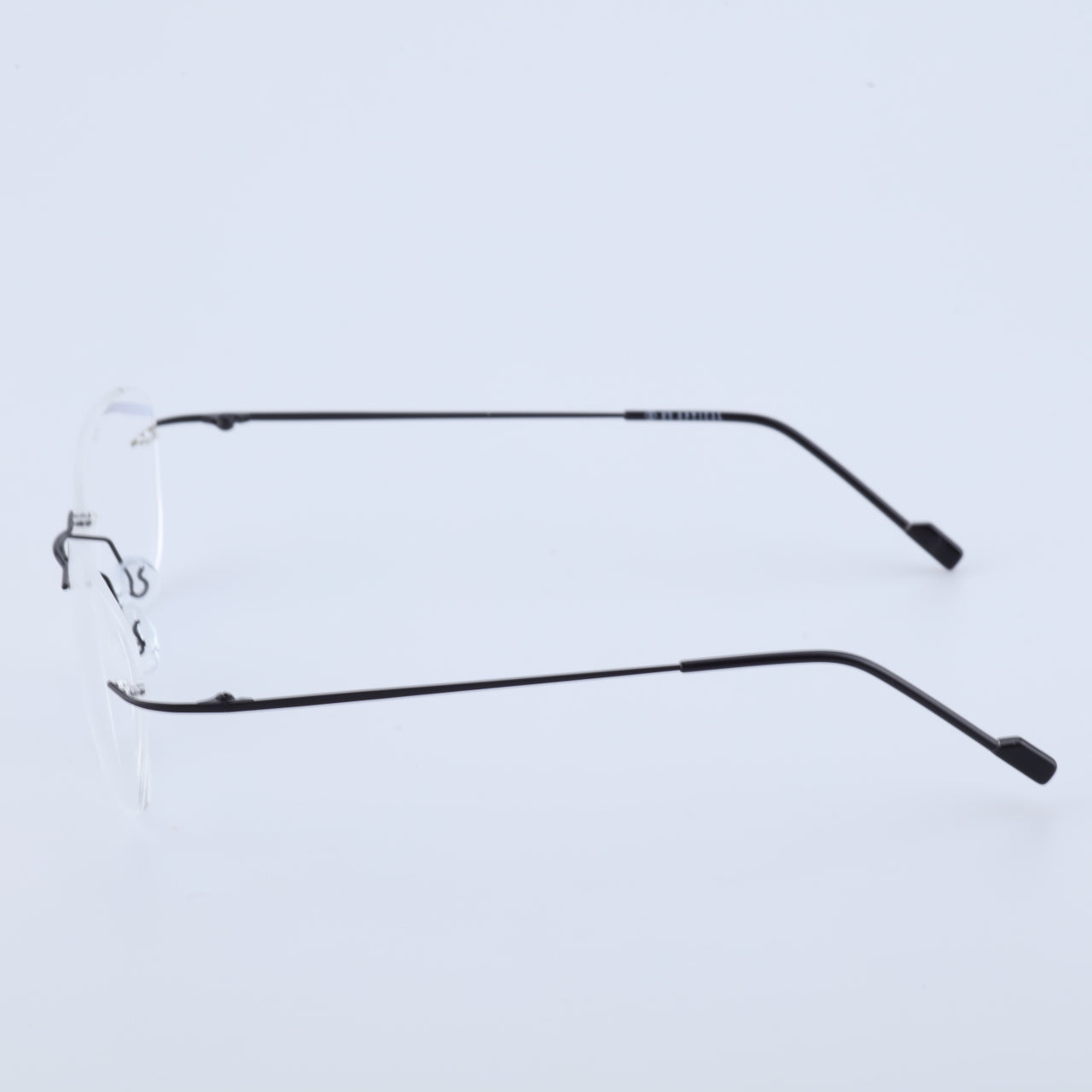 Thin black alloy rimless glasses side profile