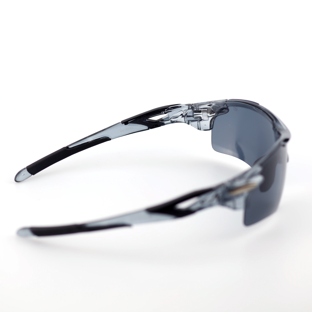 Kinetic translucent gray polymer sports sunglasses angled side view