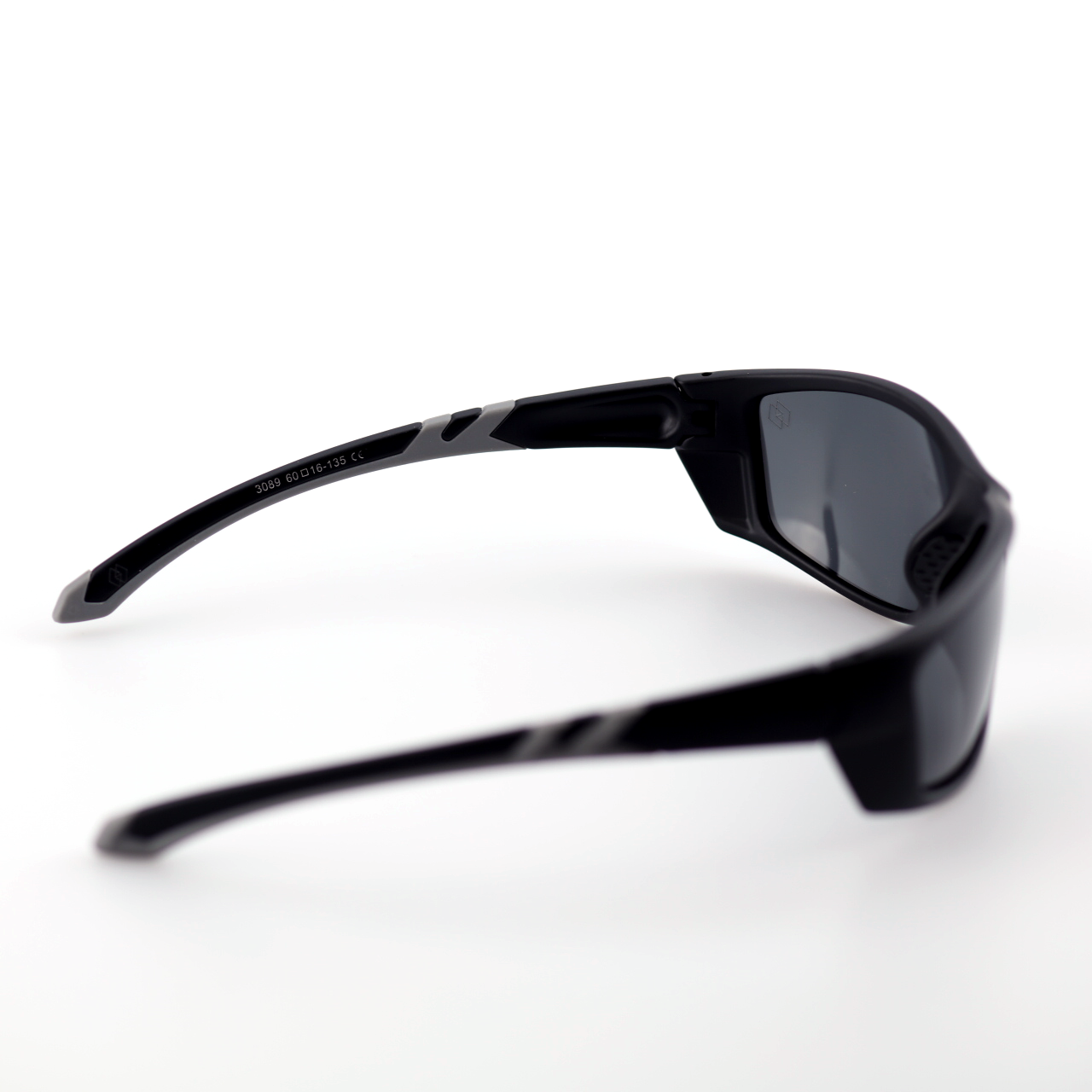 Force black polymer sports sunglasses angled side view with smoke polarized lenses