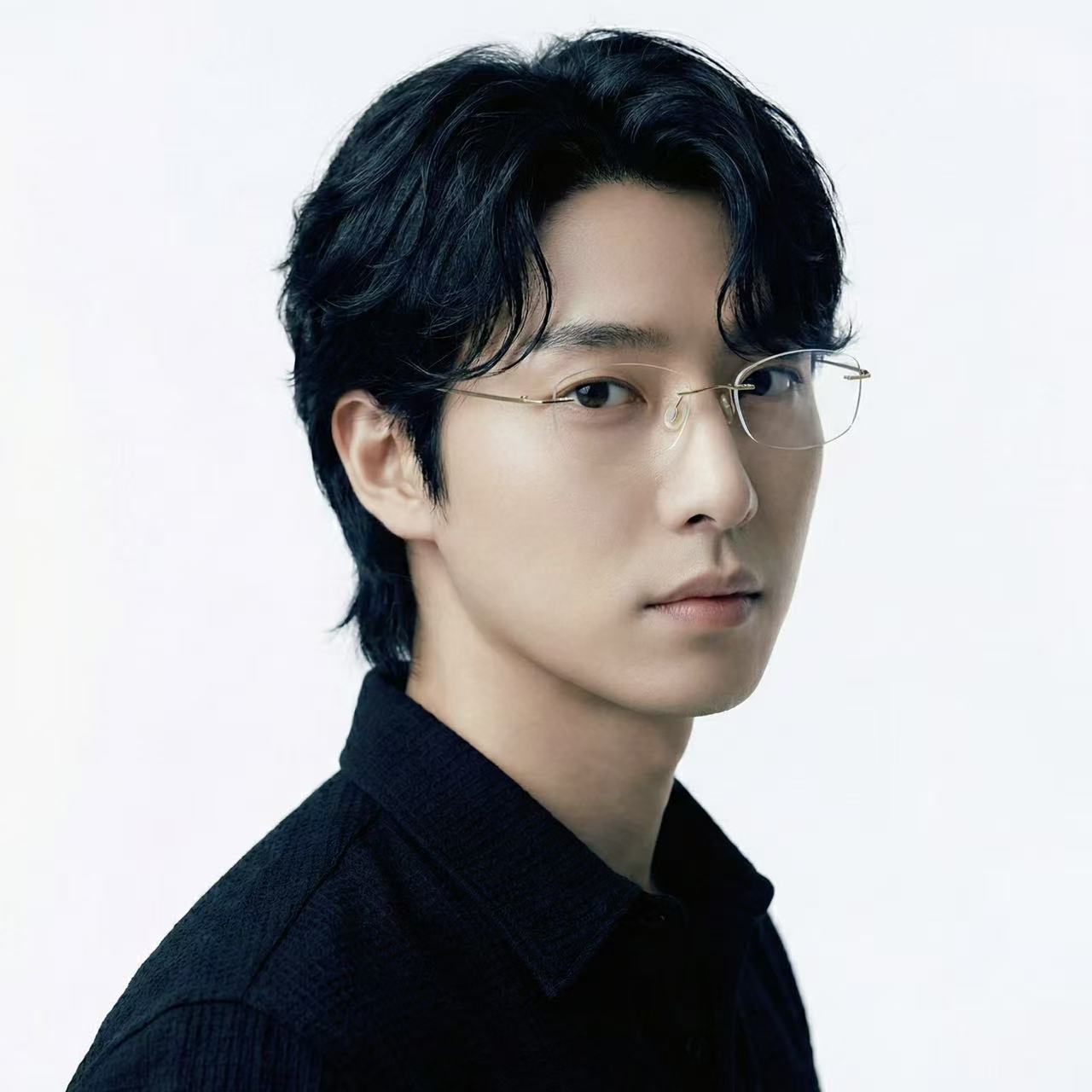 Float gold titanium rimless rectangle glasses worn by male model