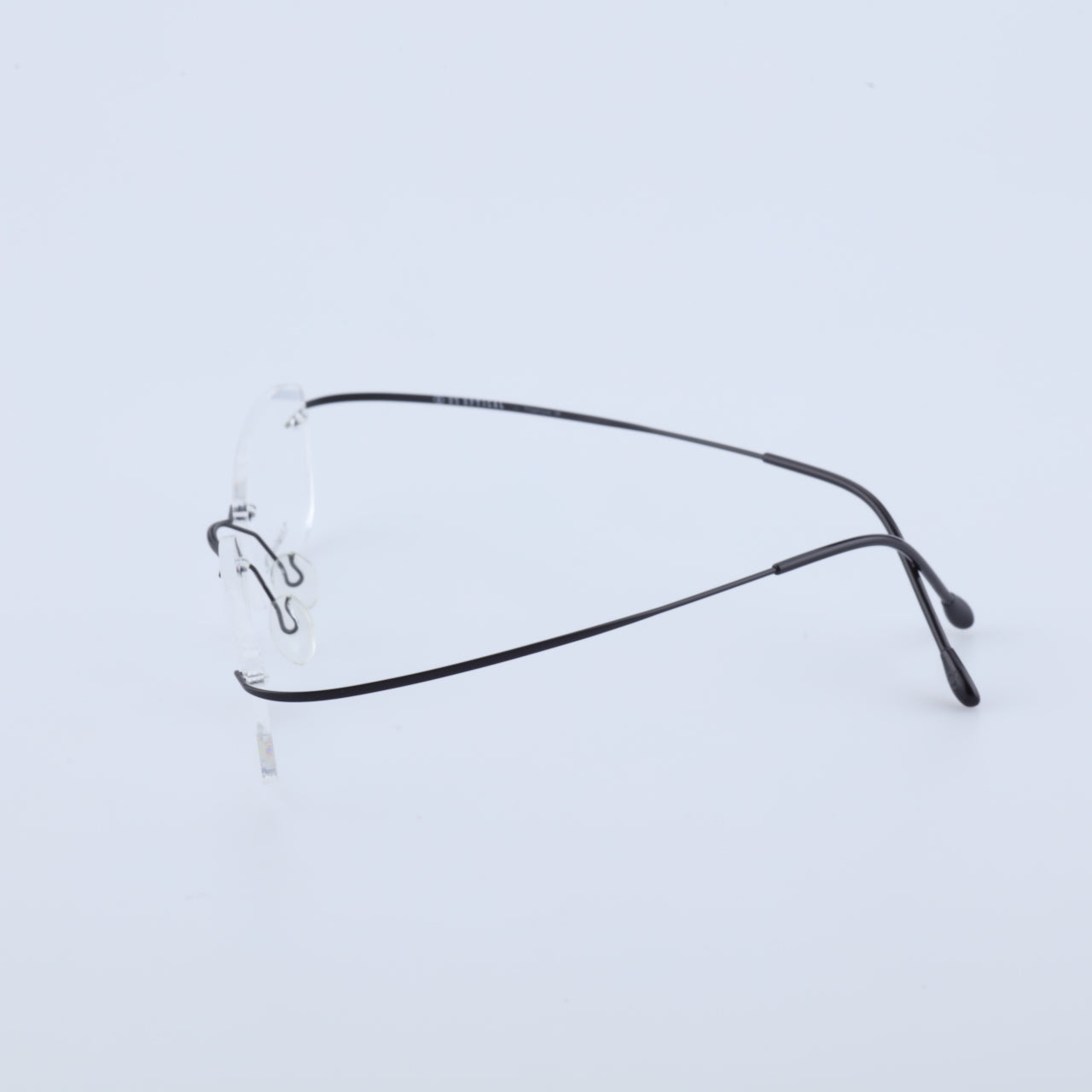 Feather lightweight titanium rimless glasses temple and nose pad detail