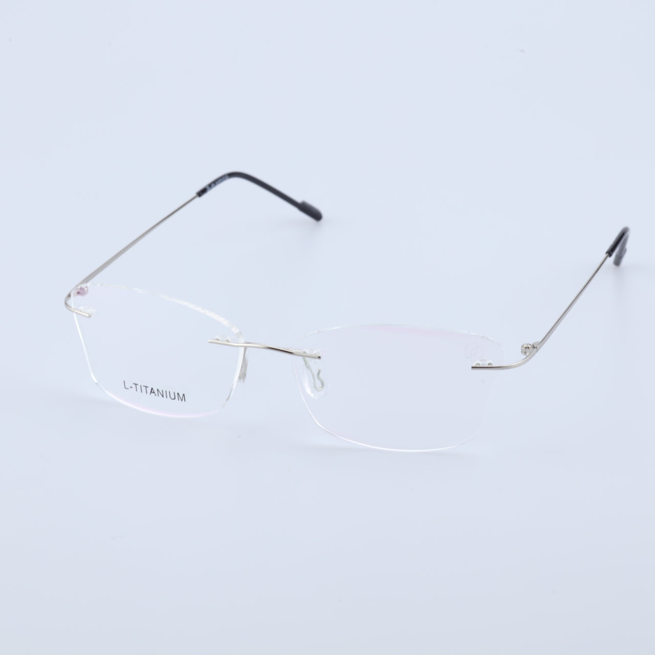 O'S OPTICAL Stow Silver titanium rimless glasses side front view with clear lenses