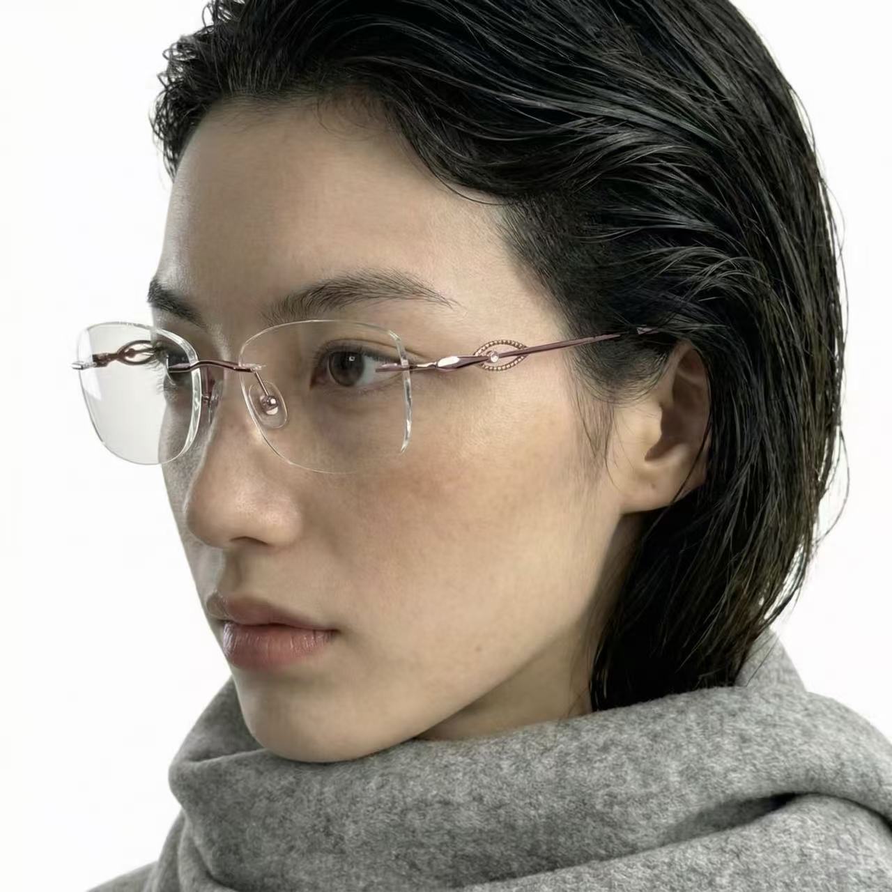 Aura pink alloy rimless rectangle glasses worn by model